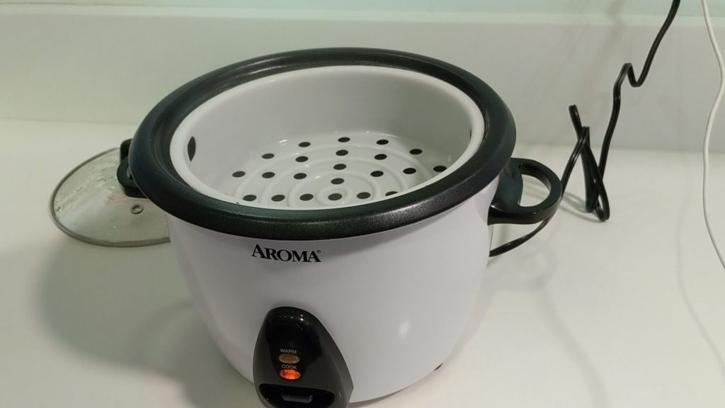 Add the steamer basket to the Aroma Wholemeal Rice Cooker